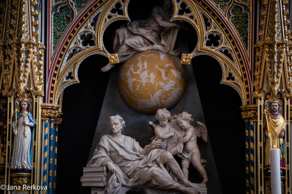 Isaac Newton’s memorial inside Westminster Abbey, with sculpted figures and celestial motifs