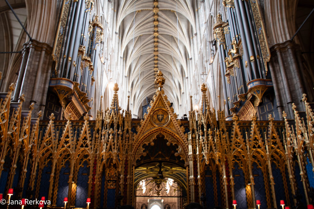 Interior of Westminster Abbey showing quire stalls, Gothic ceiling, and historic organ
