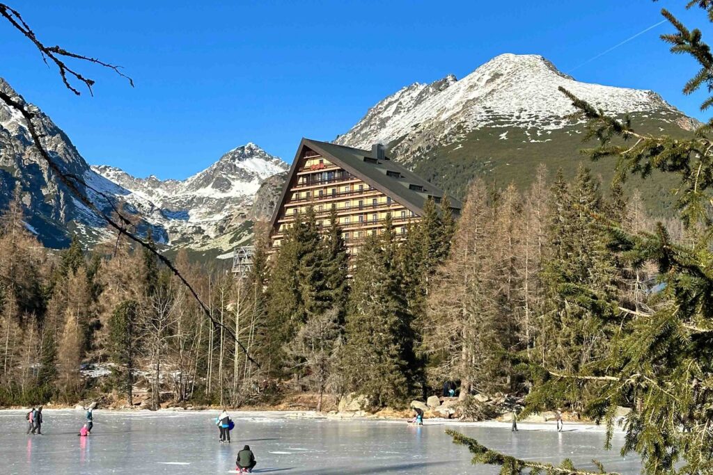 Strbske Pleso lake with the Patria hotel and mountain scenery, High Tatras, Slovakia