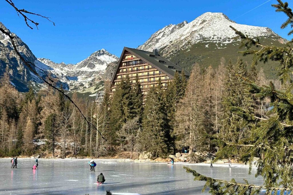 Strbske Pleso lake with the Patria hotel and mountain scenery, High Tatras, Slovakia